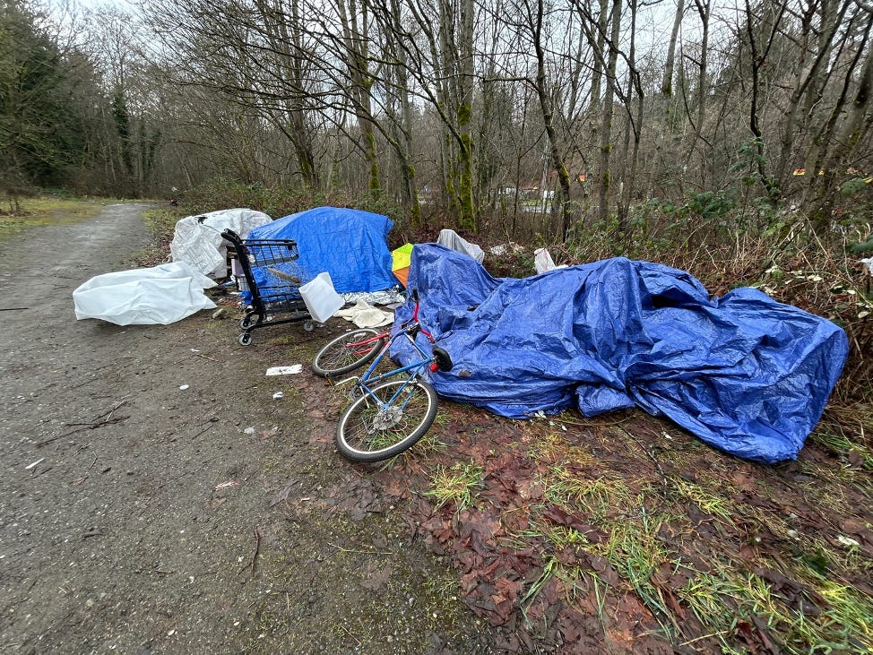 A bicycle and tarp on the ground
Description automatically generated A bicycle and tarp on the ground
Description automatically generated