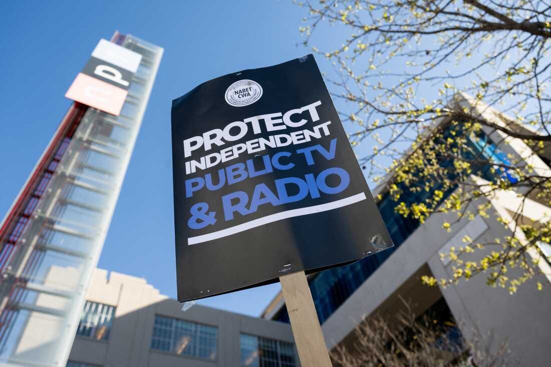 People participate in a rally to call on Congress to protect funding for US public broadcasters, Public Broadcasting Service (PBS) and National Public Radio (NPR), outside the NPR headquarters in Washington, DC, on March 26, 2025. People participate in a rally to call on Congress to protect funding for US public broadcasters, Public Broadcasting Service (PBS) and National Public Radio (NPR), outside the NPR headquarters in Washington, DC, on March 26, 2025.