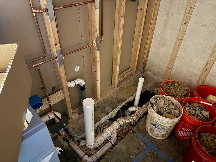 Photos of plumbing rough-in work.