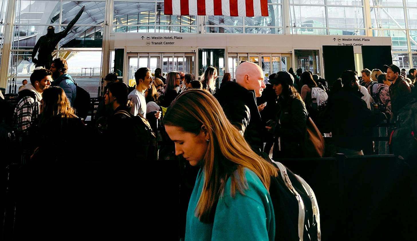 Crowd milling around in airport Crowd milling around in airport