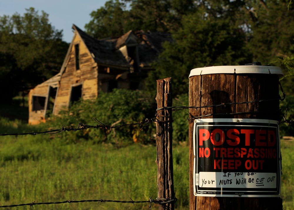 Posted No Trespassing Keep Out If you do - your bus will be cut out