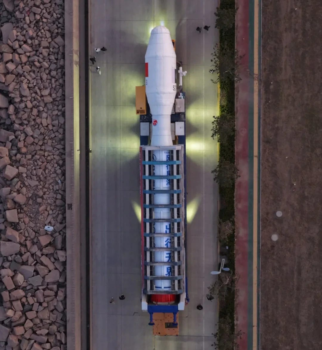 The Jielong-3 Y9 vehicle heading from its pre-launch processing facilities to its launch ship with its support equipment.