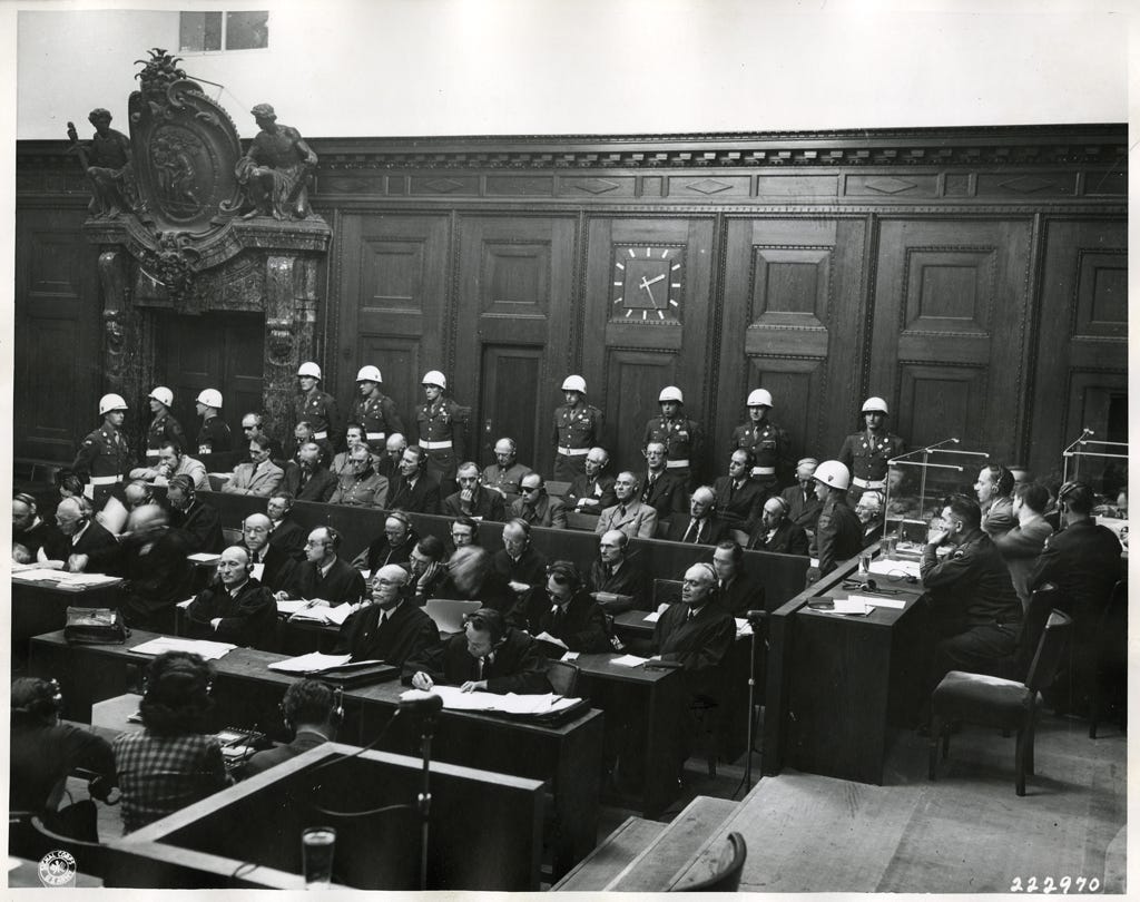  Ernst Kaltenbrunner, former deputy to Gestapo-head Himmler, is the new face among the accused at the war crimes trials, which brings the number to twenty-one.  He was absent from the courtroom at the opening due to a cranial hemmorrhage which sent to the hospital.  He is in front row fifth man from the left.
Nuernberg, Germany.  12/10/1945