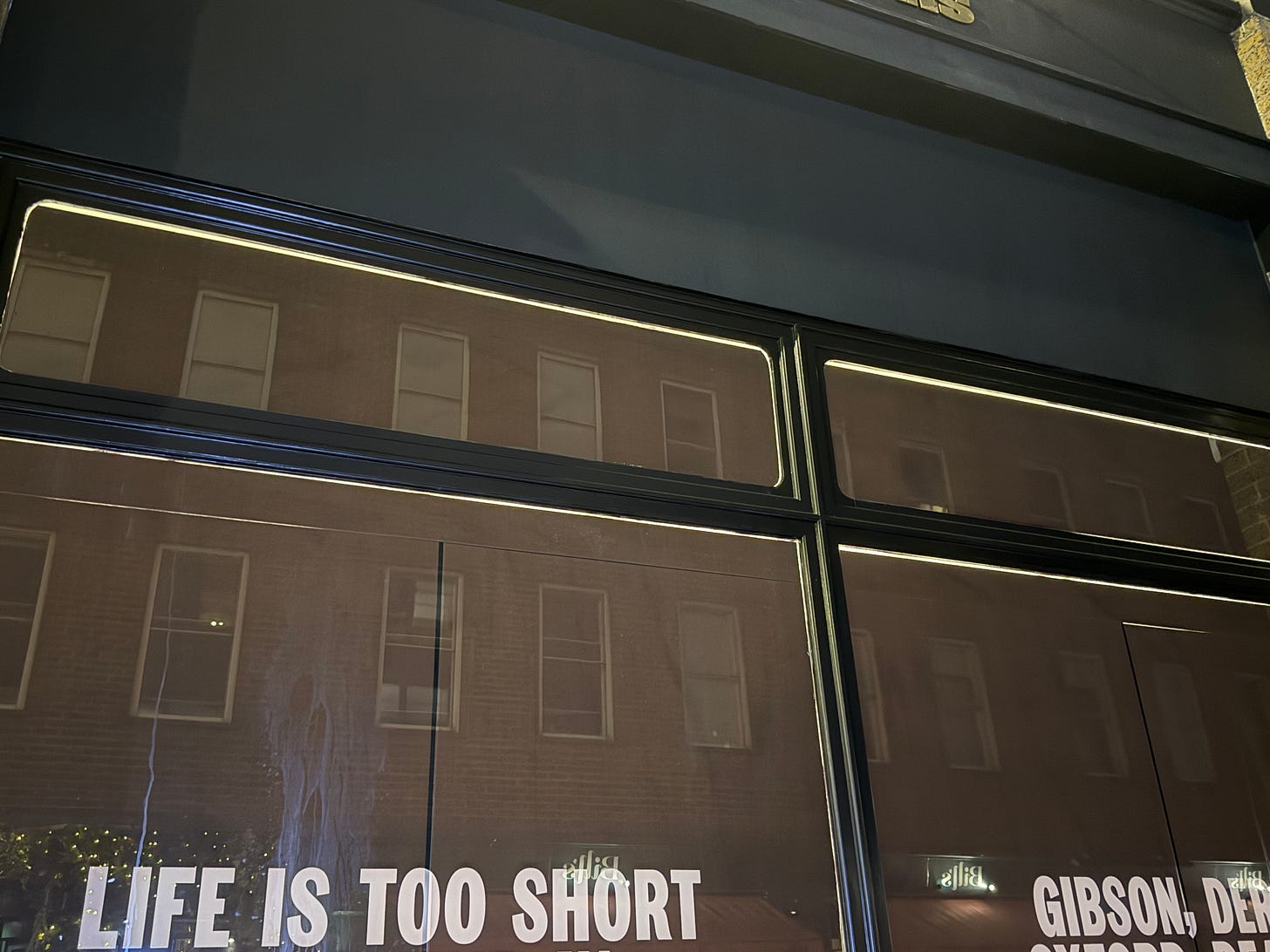 A window in London, with writing that says "Life is too short, Gibson" A window in London, with writing that says "Life is too short, Gibson"