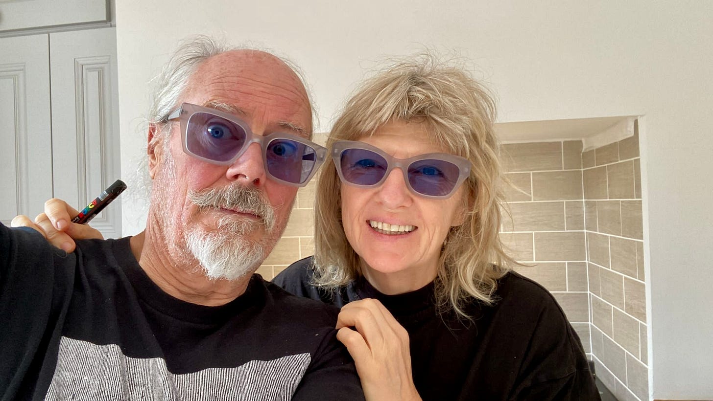 Suzy and Simon wearing glasses with blue lenses