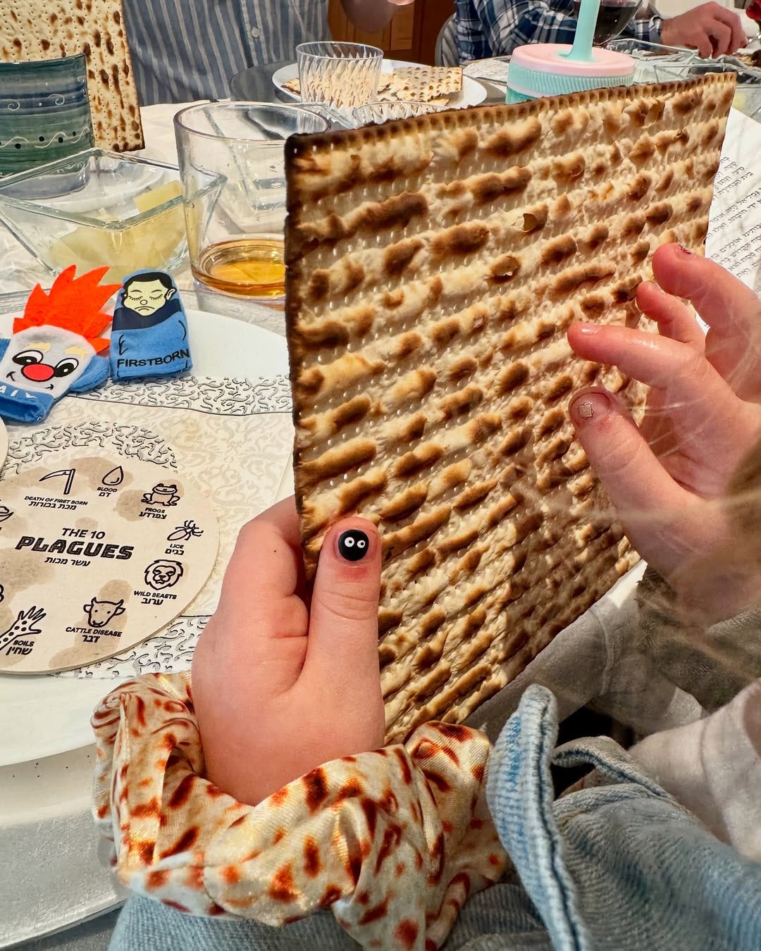 Little hands holding matzah