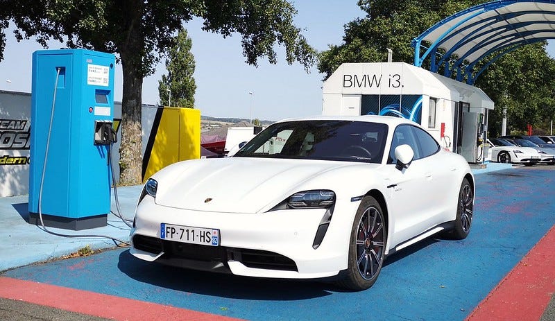 Porsche Taycan at charging station.