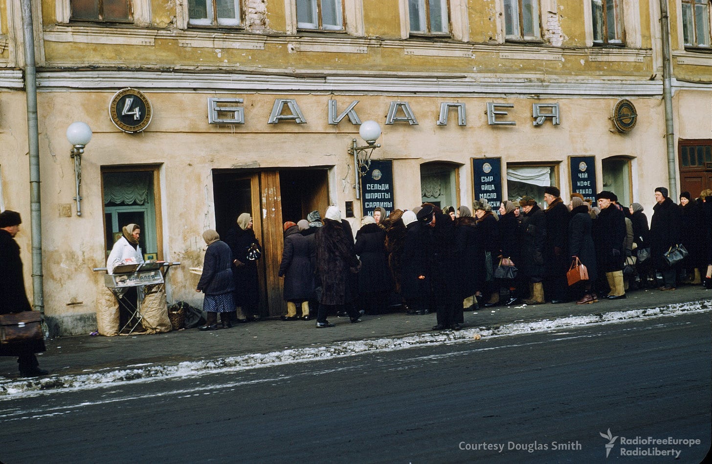 A familiar sight in 1950s Soviet Union: people patiently line up outside a grocery store, a testament to daily realities. A familiar sight in 1950s Soviet Union: people patiently line up outside a grocery store, a testament to daily realities.