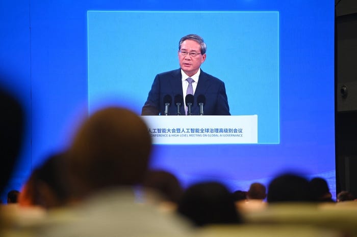 Chinese Premier Li Qiang speaking on a screen at the World Artificial Intelligence Conference.