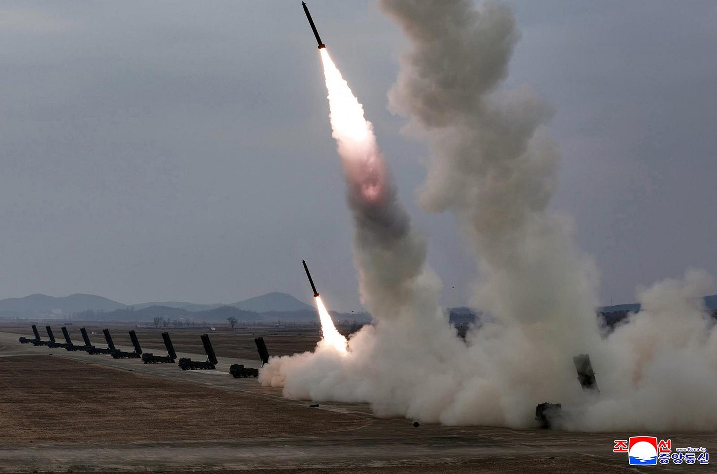 North Korea carries out a firepower strike drill involving 600 mm ultra-precision multiple rocket launchers March 14, in this photo published by the Korean Central News Agency the following day. Yonhap
