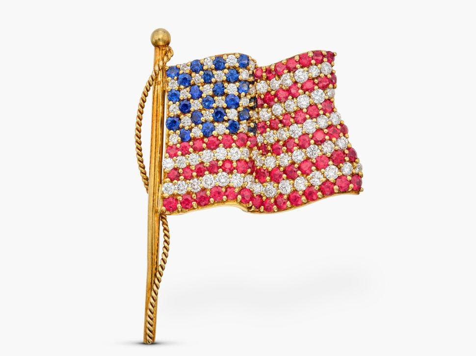 An american flag brooch in gold