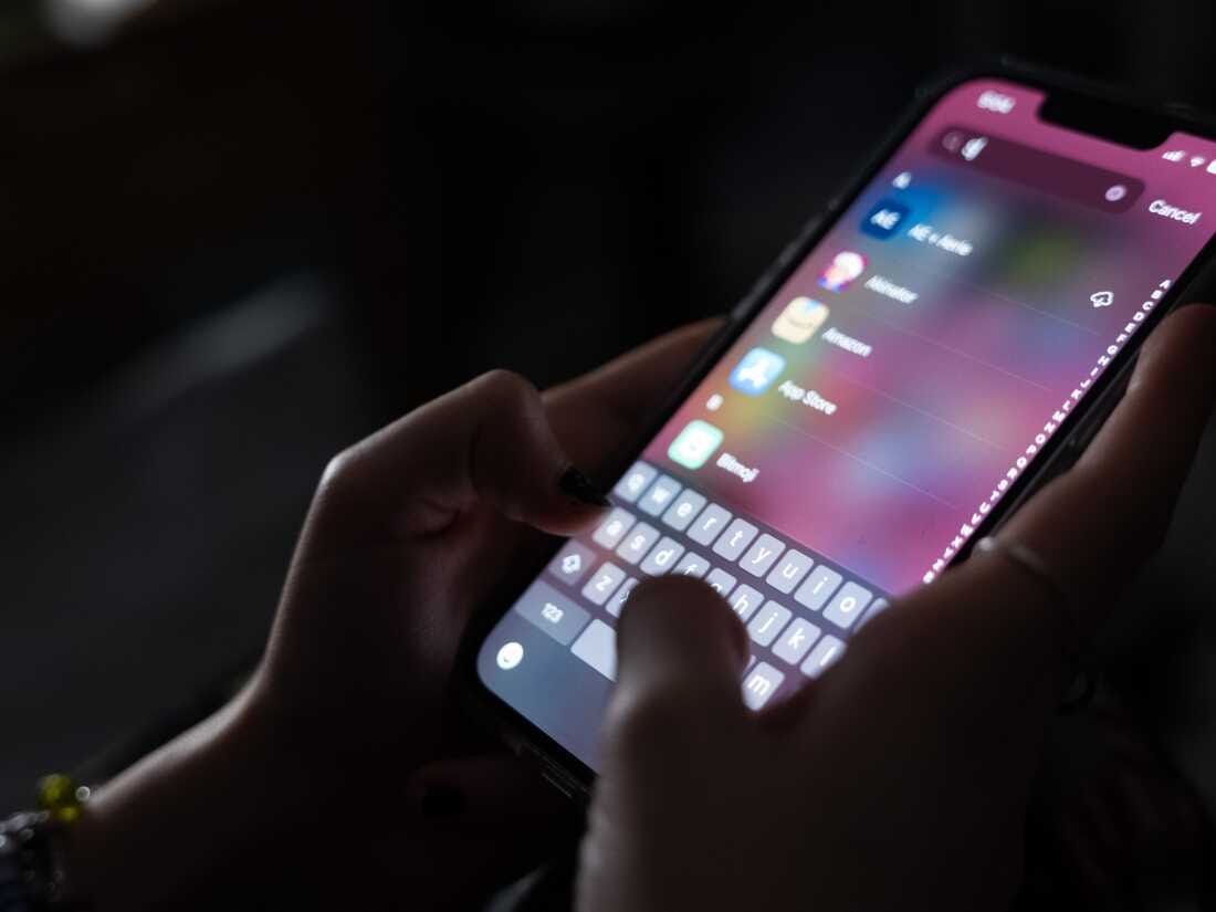A teenager uses her mobile phone to access social media on Jan. 31, 2024, in New York City. The city may soon become the largest school district in the nation to ban cellphones for students.
