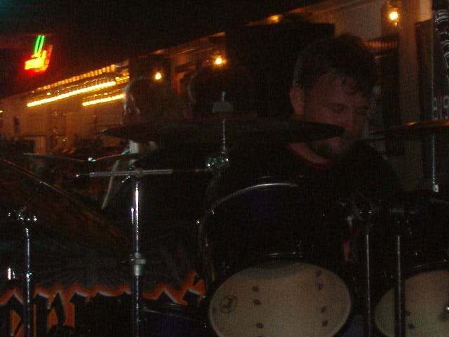 Lynn hammering on his drums. It's hard to get his pic in the back. Lynn hammering on his drums. It's hard to get his pic in the back.