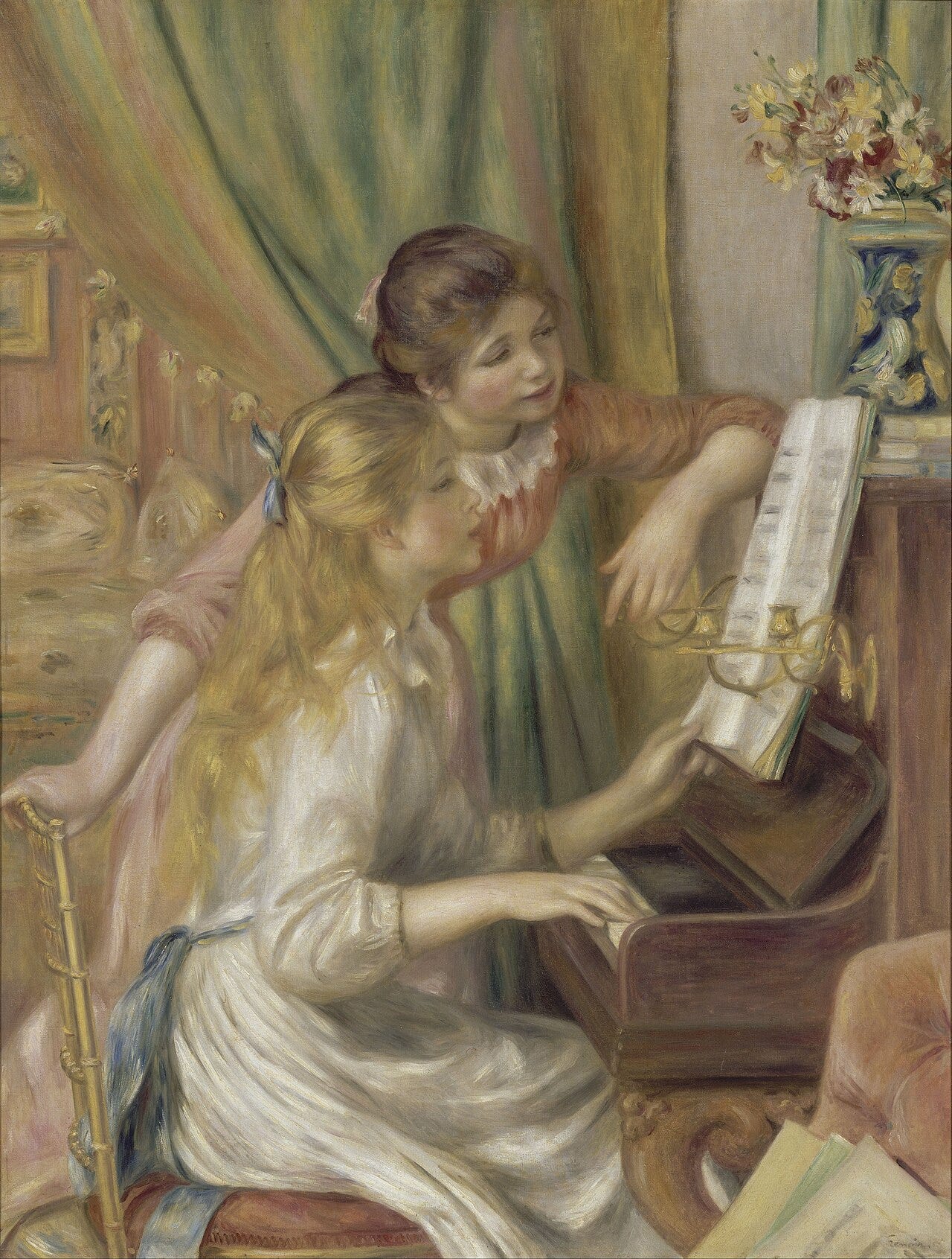 Two girls leaning over a piano together Two girls leaning over a piano together