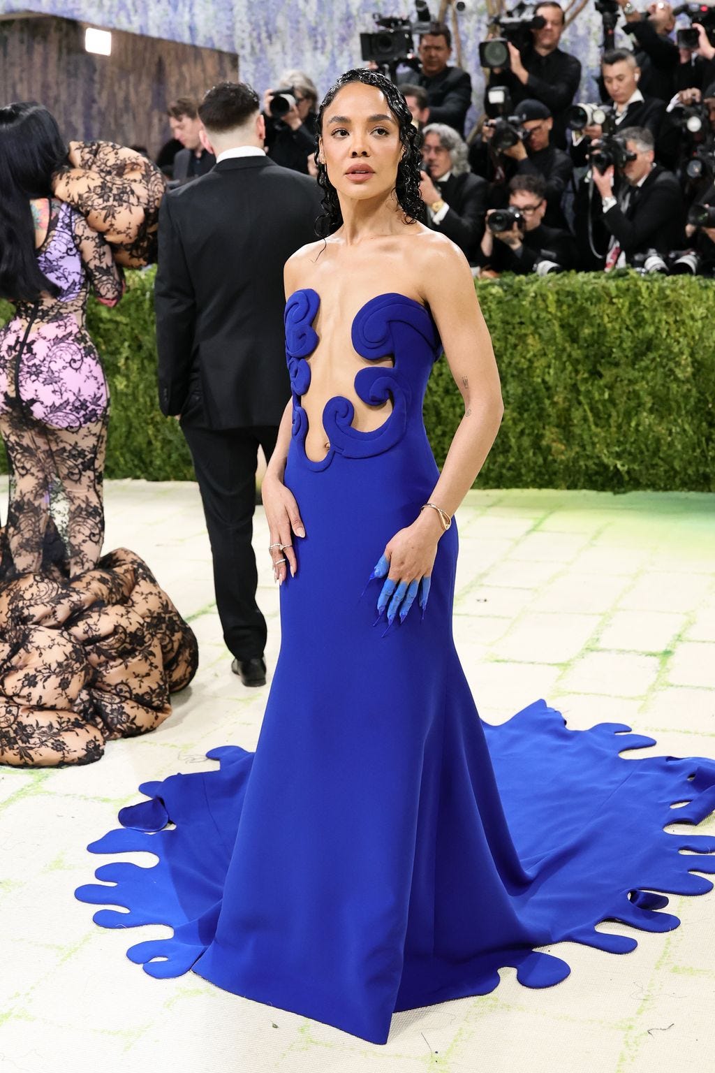 Image may contain Sharon Leal Kalani Sitake Clothing Dress Formal Wear Fashion Adult Person Wedding and Electronics