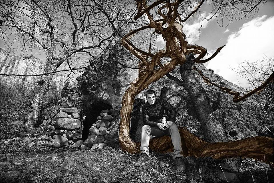 Giorgi Natenadze with a wild vine (Photo courtesy Natenadze's Wine Cellar)