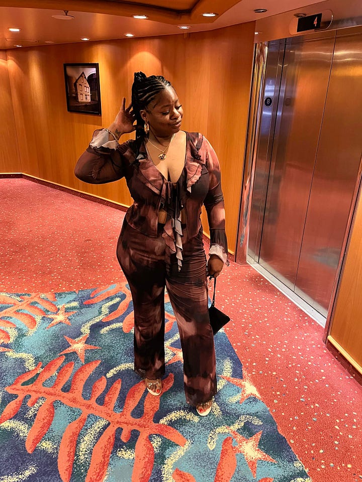 Left to right: Black women similing in the hallway near an elevator dressed in a blue silk outfit. Black women standing a hallway near an elevator on a cruise ship dressed in a brown matching outfit. Black woman admires the sea at night on a cruise ship dressed in a green sheet matching pants set. Black woman poses on a stair case in orange matching set.