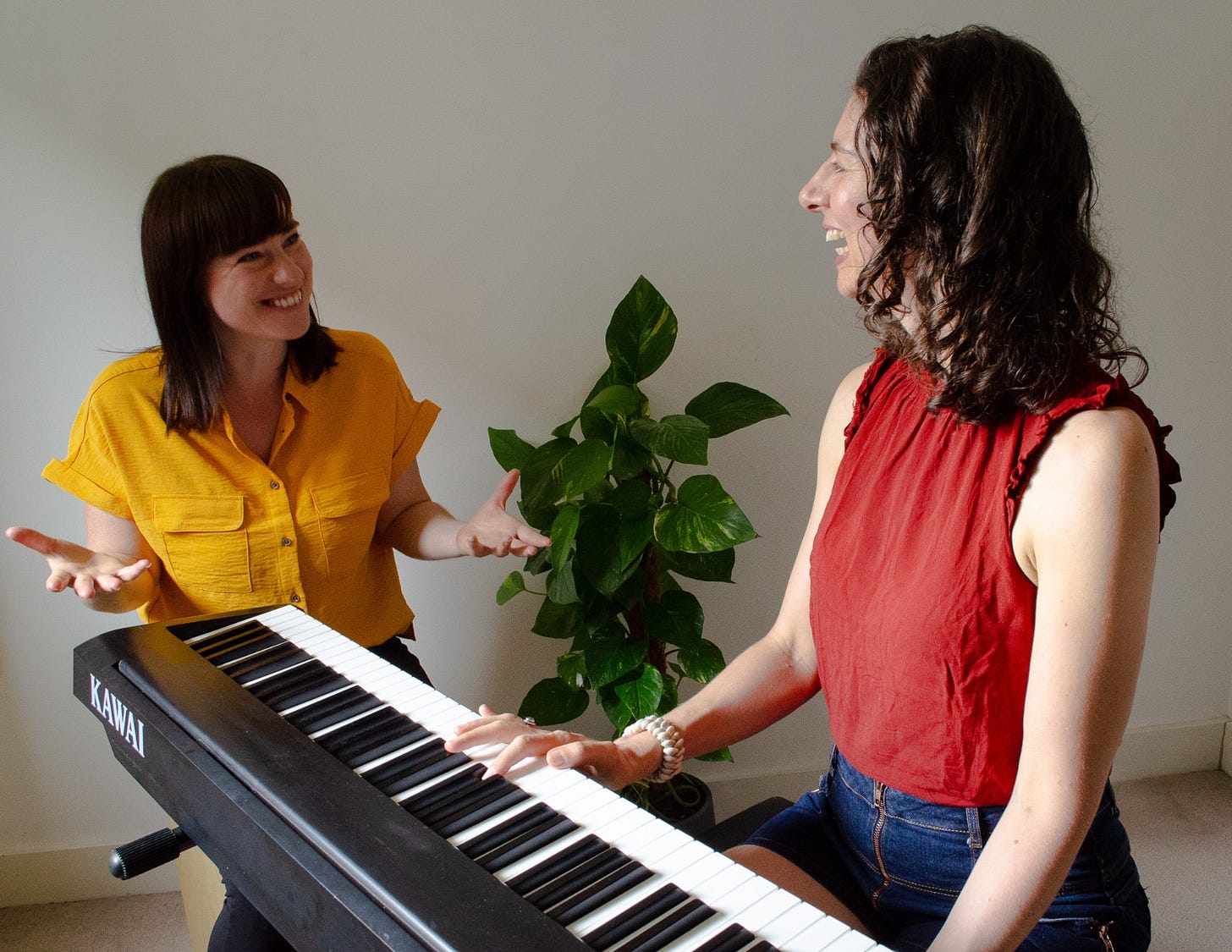 Claire Housego teaching Danielle Styles piano – both women are smiling Claire Housego teaching Danielle Styles piano – both women are smiling