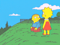 The Simpsons: Ralph rolls down a hill, away from Lisa