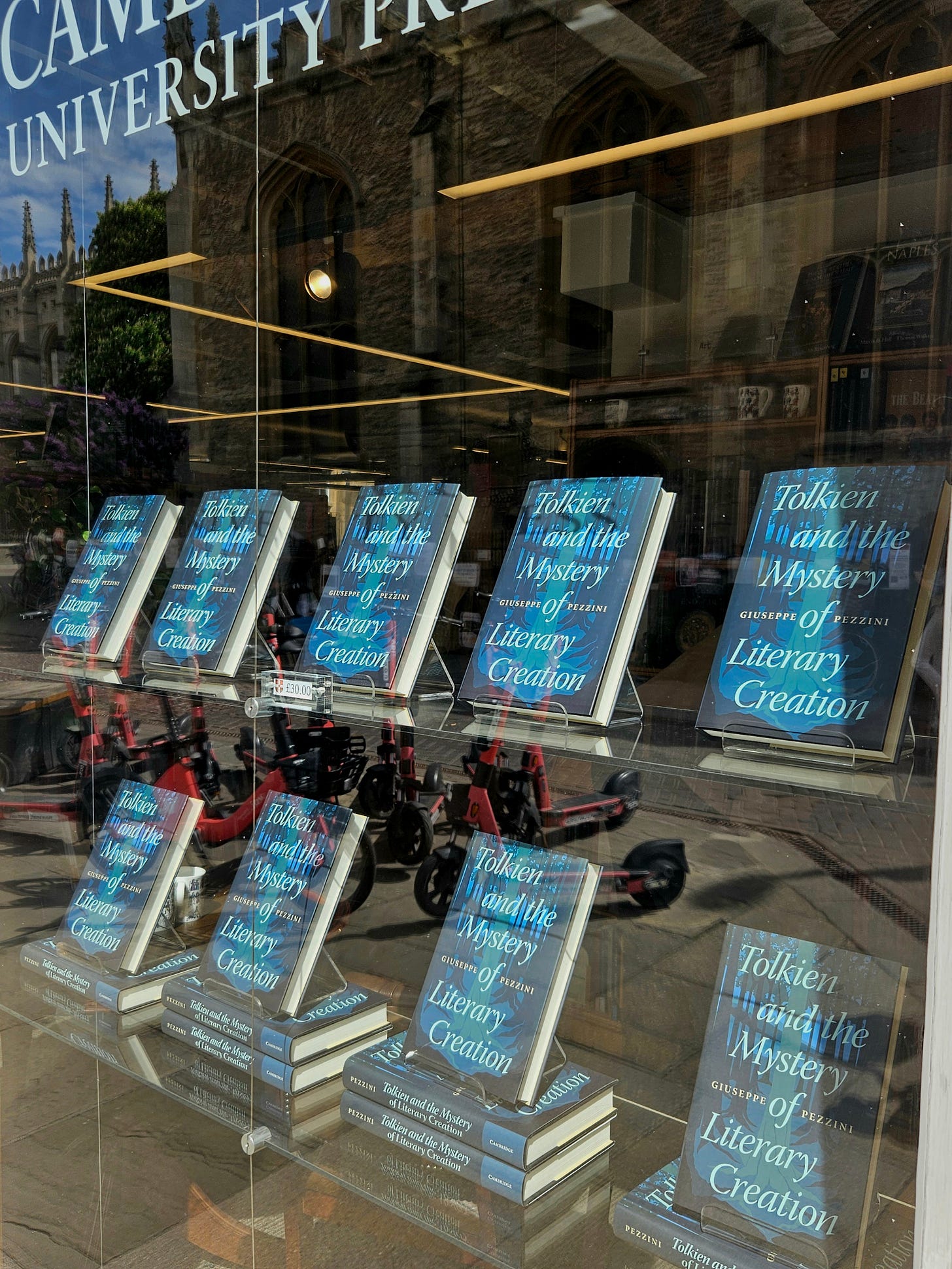 Window display of Cambridge University Press Bookshop showing multiple copies of the book 'Tolkien and the Mystery of Literary Creation' by Giuseppe Pezzini.