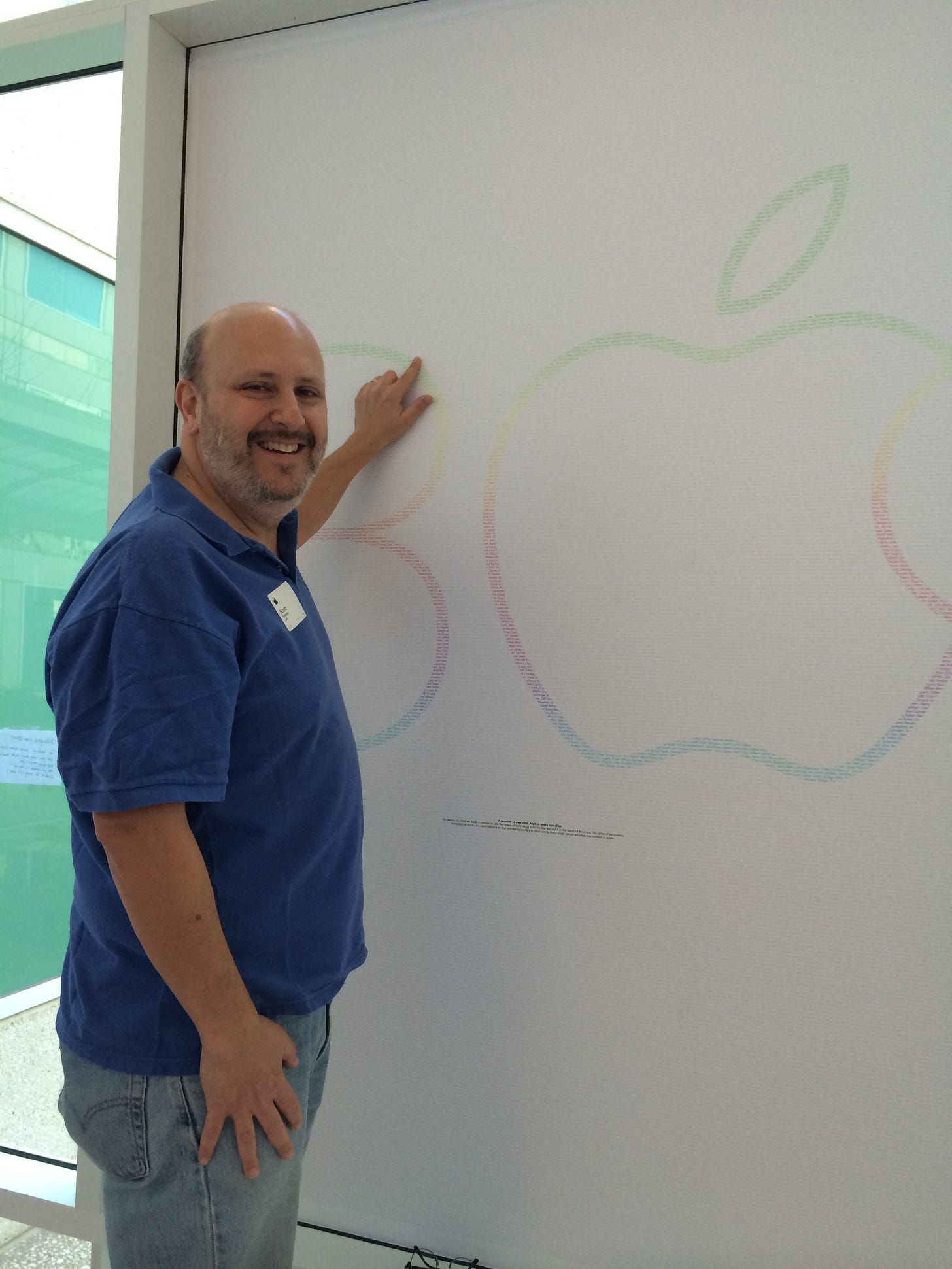The author pointing at his name on the poster.