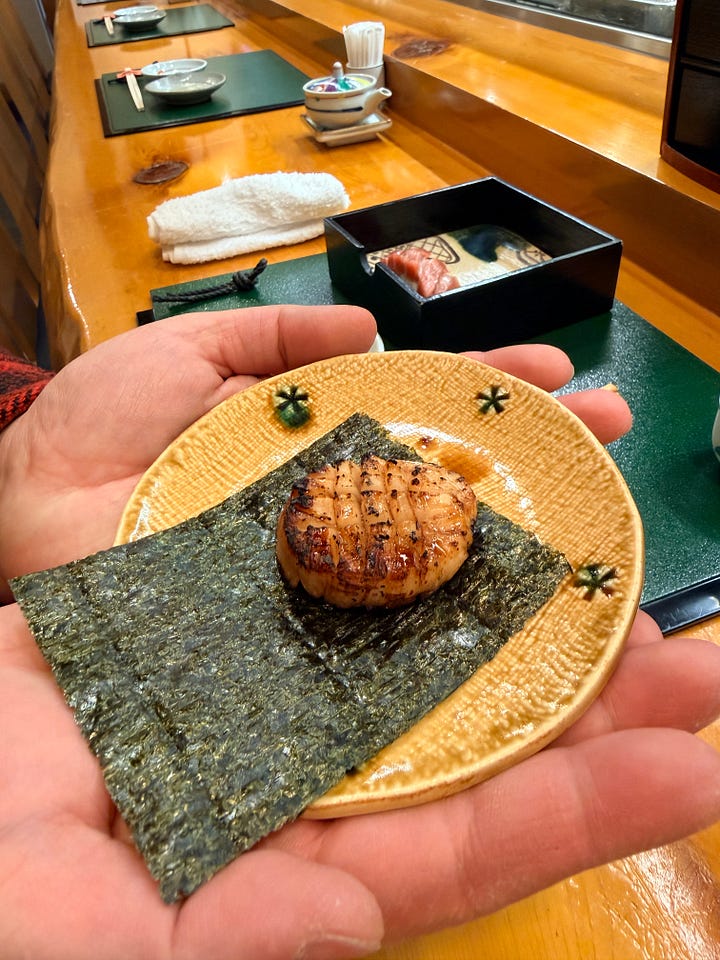 Three box set which included a sperm sac appetizer, a three tiered sushi bento and an extra grilled scallop