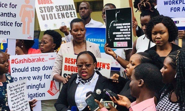 A demonstration of women with placards referencing the Samantha Mwesigye case