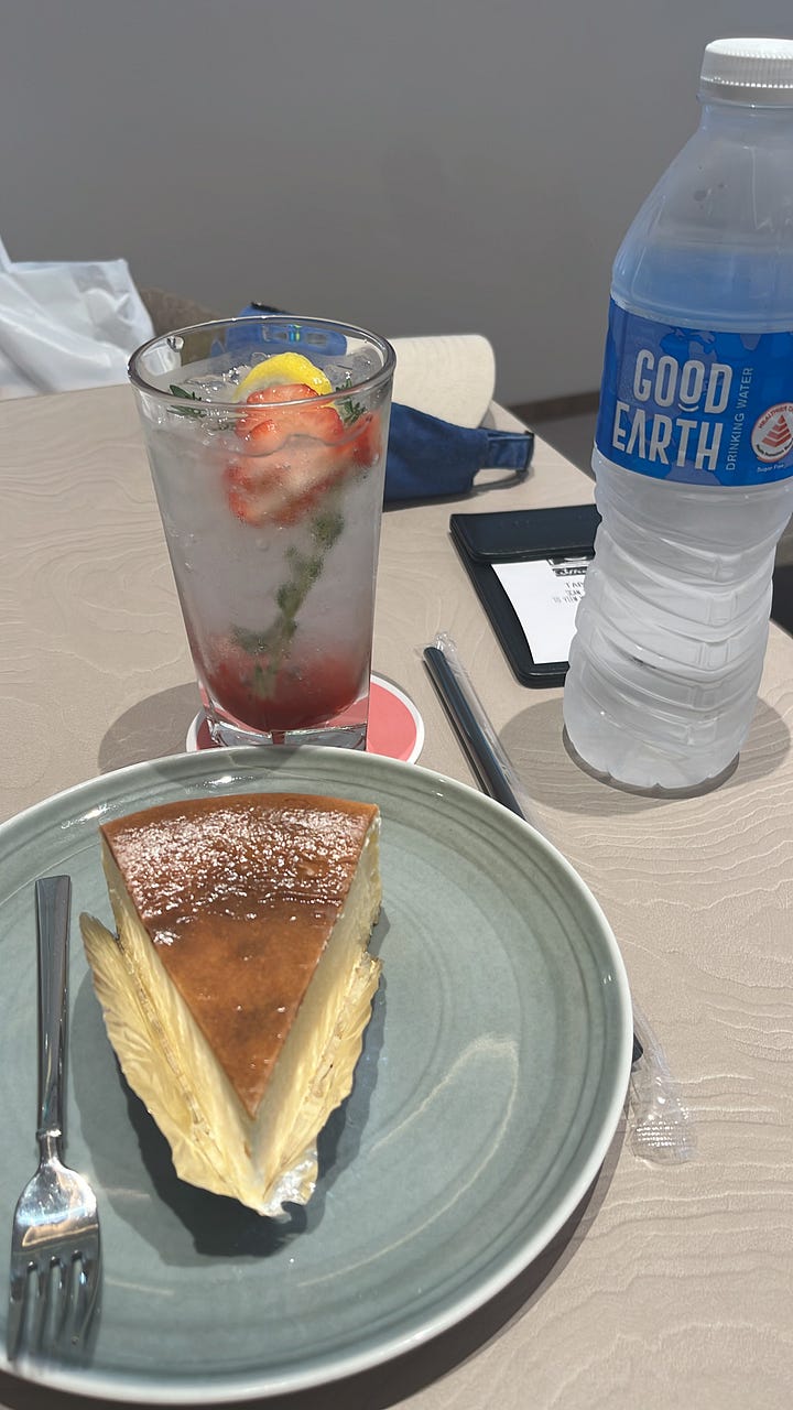 Left photo: exterior of the O'Coffee Club shop. A brown awning hangs above the shop's entrance and O'Coffee Club is written in white letters on the awning. Right photo: A slice of cheesecake, strawberry lemon soda and a bottle of water on a cafe table. 