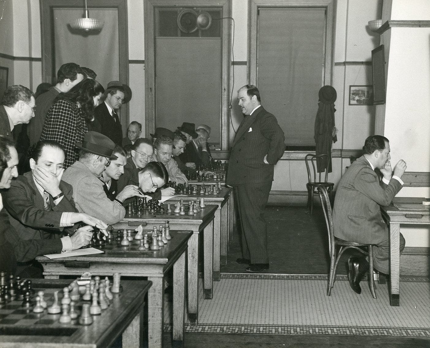 May be an image of 10 people and chess