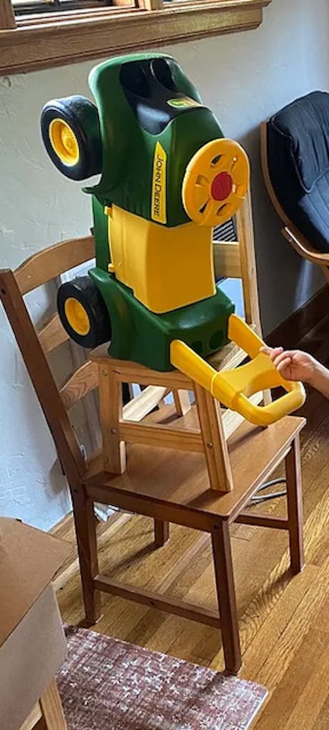 Chairs and toys stacked. (Photo by Author)