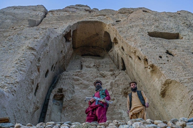 Members of Taliban stand in front of the site where the Shahmama Buddha statue once stood before being destroyed in Afghanistan. Members of Taliban stand in front of the site where the Shahmama Buddha statue once stood before being destroyed in Afghanistan.