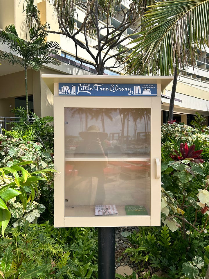 Please Enjoy Your Stay bookmarks, an empty free library, BookEnds, and a view of the ocean