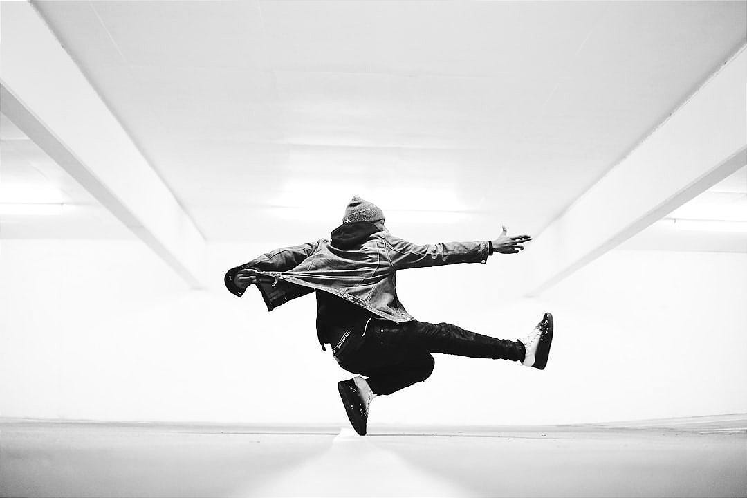 man jumping in the middle taken at daytime man jumping in the middle taken at daytime