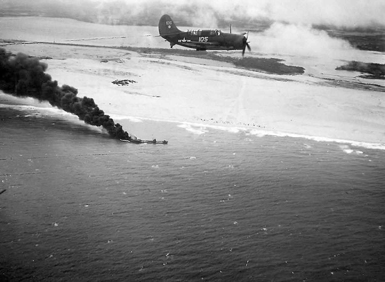 USN Curtiss SB2C-3 Helldiver from USS Hornet overflying the burning Japanese tanker Kyokuun Maru off the coast of present day Vietnam on January 12, 1945. USN Curtiss SB2C-3 Helldiver from USS Hornet overflying the burning Japanese tanker Kyokuun Maru off the coast of present day Vietnam on January 12, 1945.