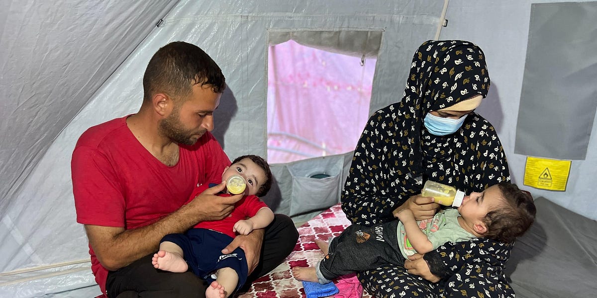 A Gazan mother feeds her twins lentils instead of milk as blockade continues