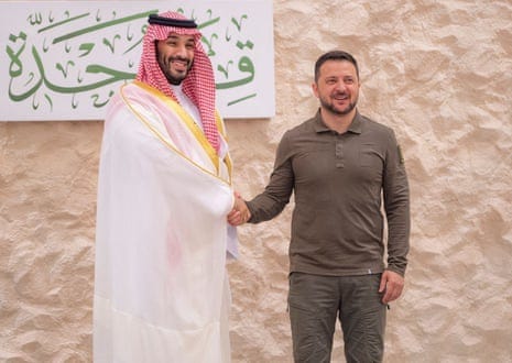 Saudi crown prince Mohammed bin Salman shakes hands with Ukrainian president Volodymyr Zelenskiy, ahead of the Arab League summit, in Jeddah, Saudi Arabia, May 19, 2023.