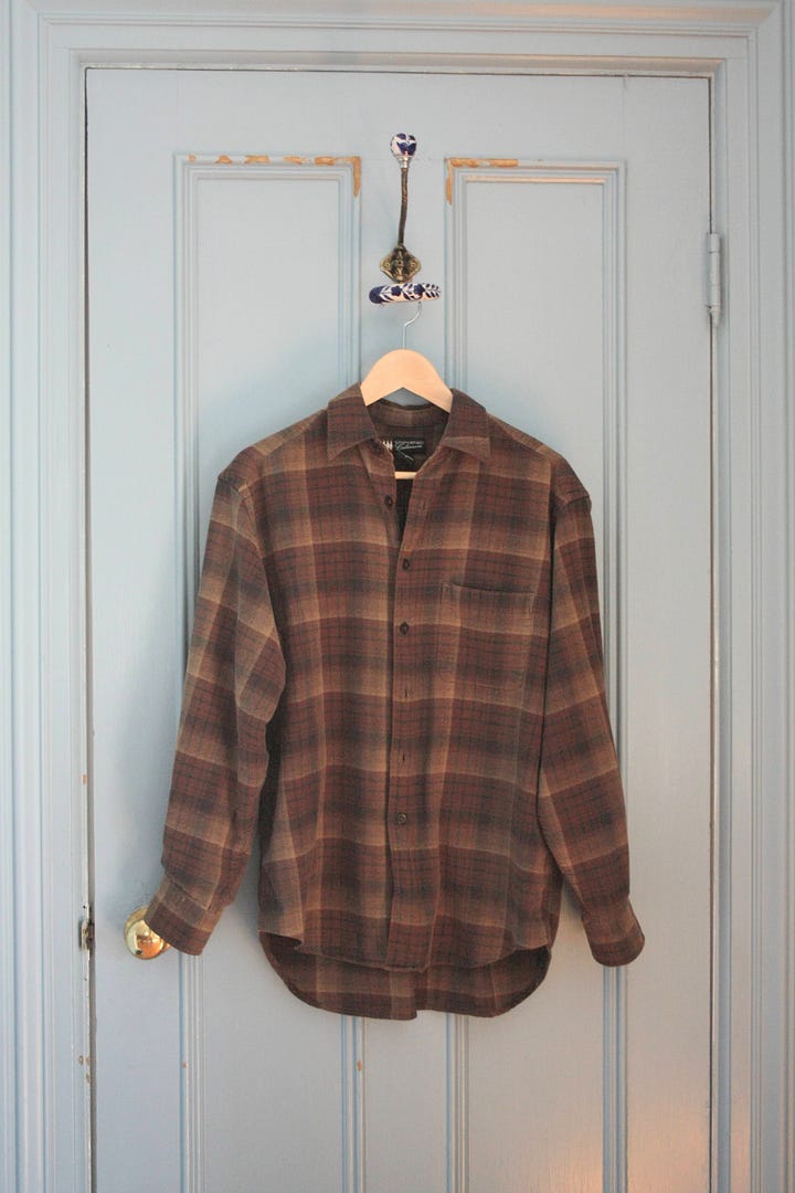 Two items, a plaid shirt and a green fleece