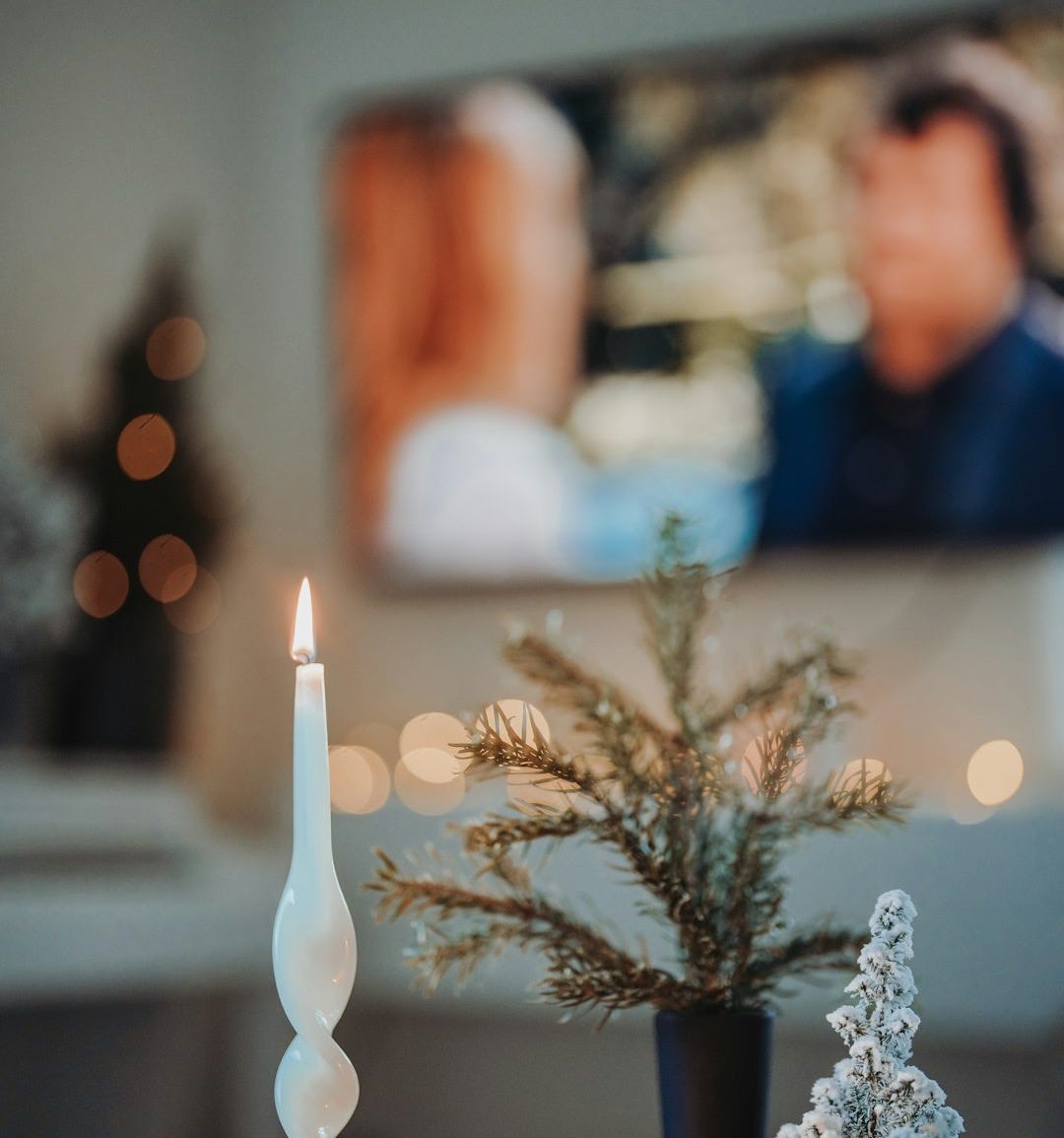 a couple of candles sitting on top of a table