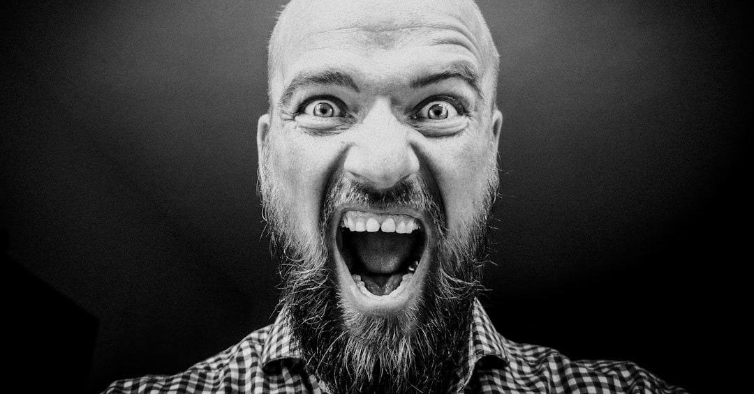 grayscale photography of man opening his mouth grayscale photography of man opening his mouth