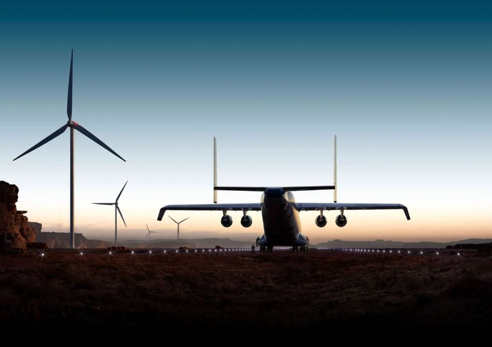 Illustration of the world's largest cargo plane, the Radia WindRunner, on a runway near wind turbines.