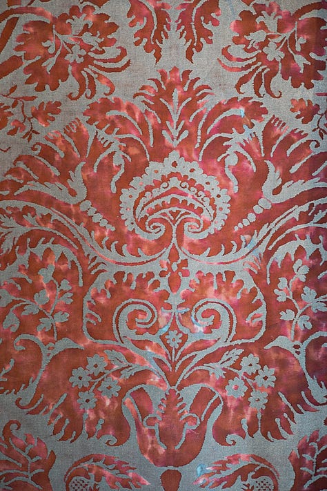 Detail of a red velvet garment in a Venetian painting