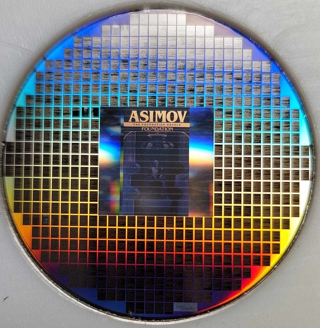 A technicolor circle with metallic squares and "Asimov Foundation" in the center A technicolor circle with metallic squares and "Asimov Foundation" in the center