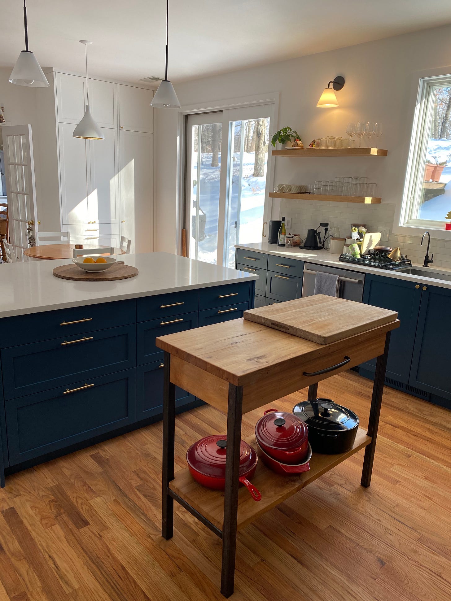 Kitchen with white counter tops and blue drawers and cupboards.  Kitchen with white counter tops and blue drawers and cupboards.