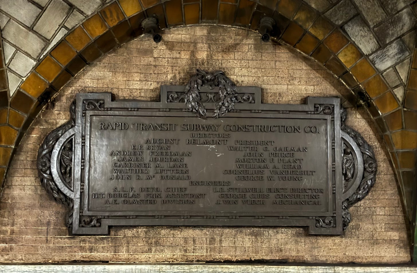 The second seal, beneath amber tiles. It lists the board of directors of the Rapid Transit Subway Construction Co.