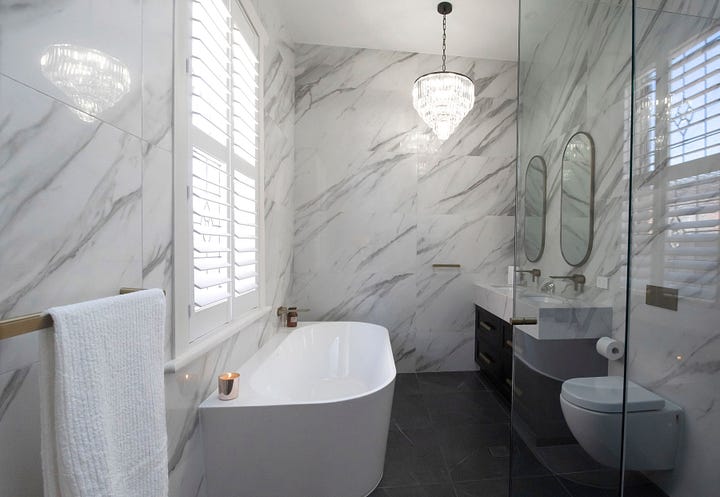 luxurious black and white ensuite bathroom designed by Plush Design Interiors and Penelope Herbert