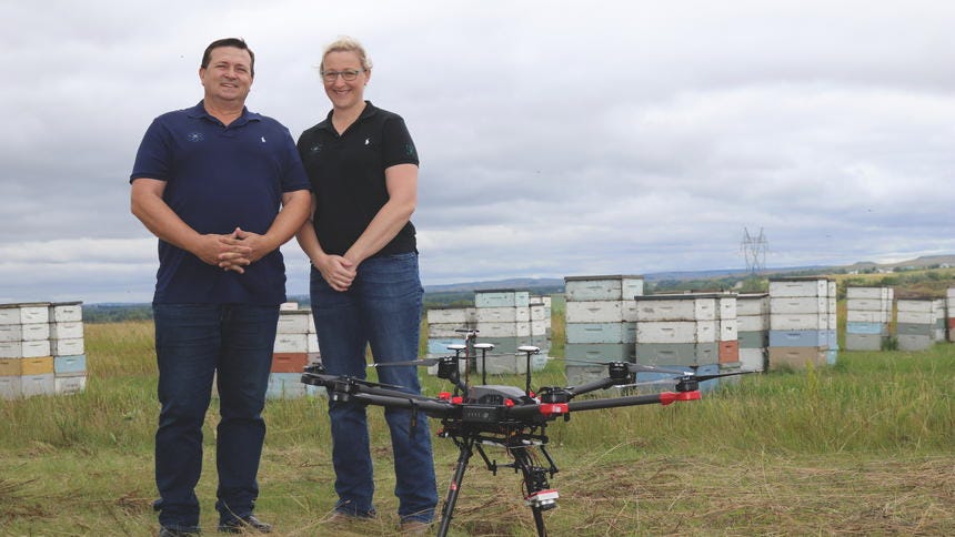 Image of owners with drone. Image of owners with drone.