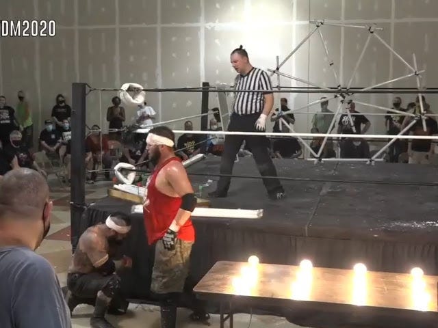 [Screenshot: SHLAK and Patricks outside the ring, near the light bulb table]