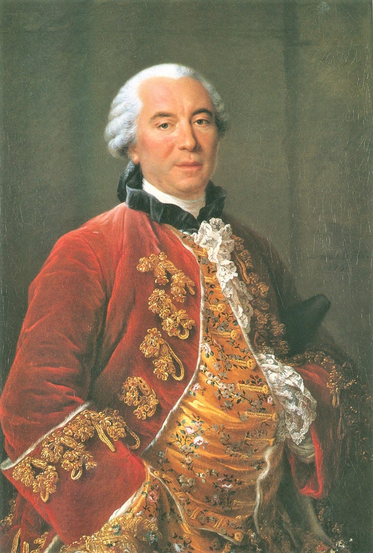 man in white wig, red jacket, lots of gold frogging