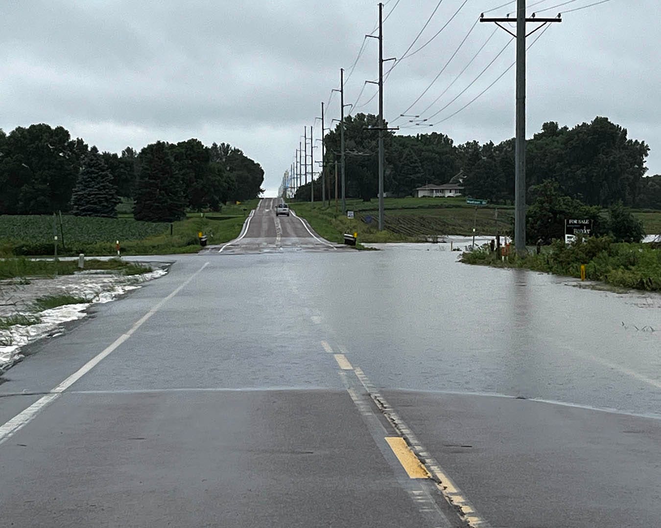 May be an image of 1 person, road and body of water