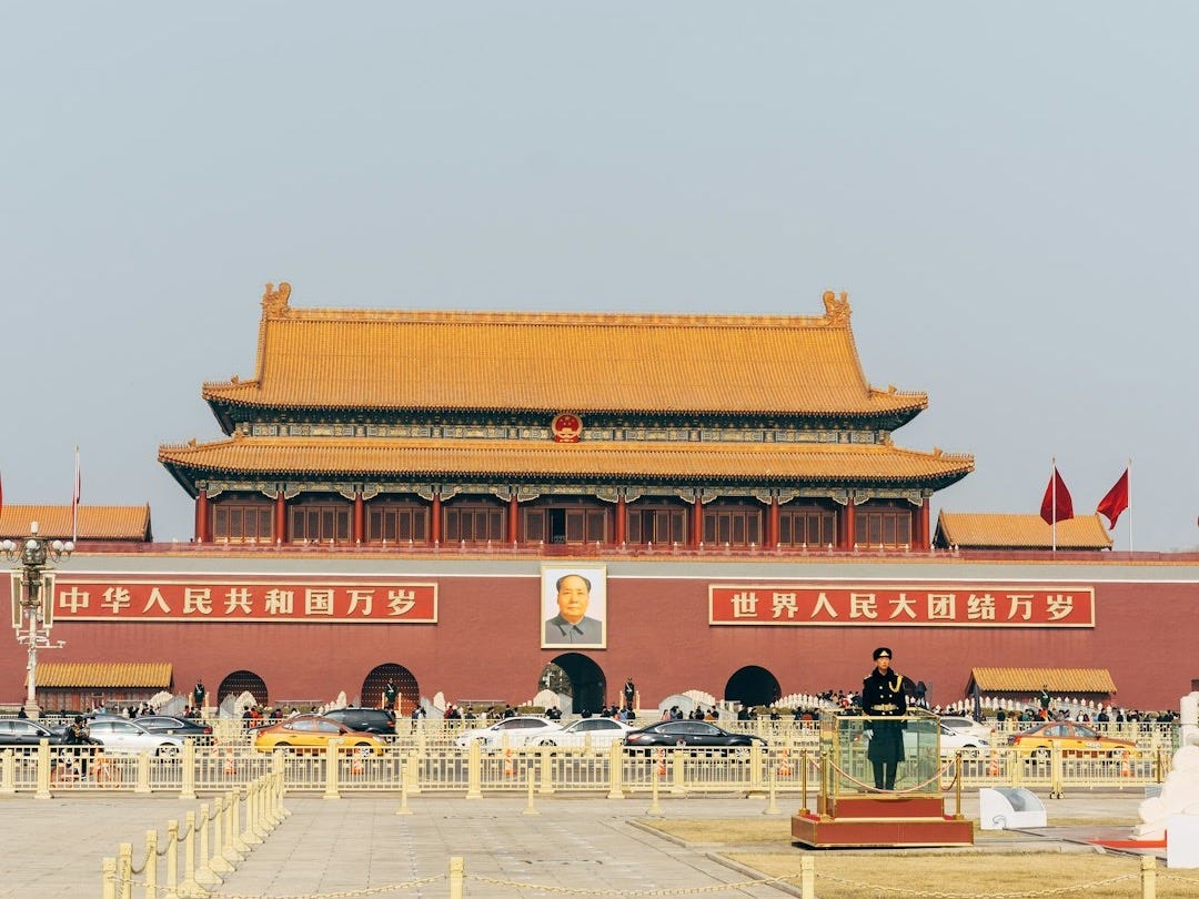 people walking on red and brown temple during daytime